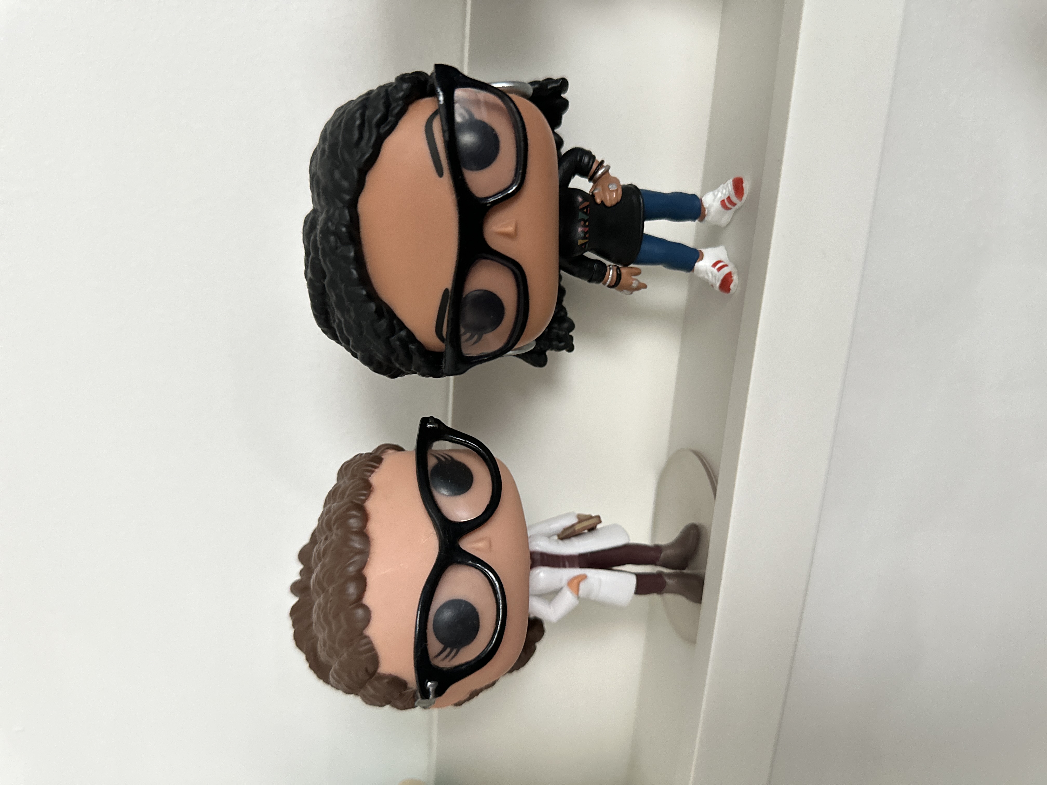 POP! Cosima Niehaus and POP! Ava DuVernay on a white shelf against a white background